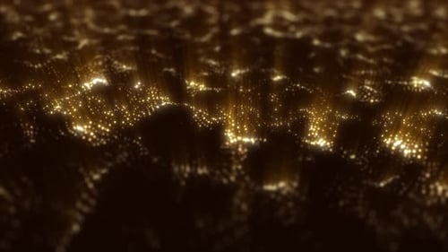 Glowing golden particle waves flowing in soft motion