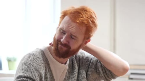 Tired Man at Work with Neck Pain