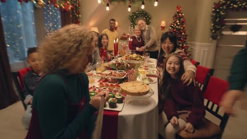 Happy Multi-Generational Family at Christmas Dinner Taking Selfie