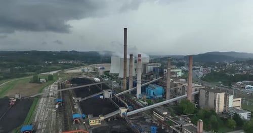 Aerial Drone Footage of a Large Coal Power Plant Station with Cooling Towers Chimney and Boiler
