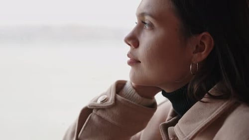 Thoughtful Woman Gazing Out Window