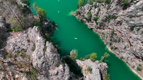 Aerial View Paddleboarding Adventure Through the Green Canyon People Enjoy Nature and Relax