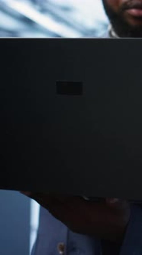 Vertical Video Close Up of IT Professional in Data Center Fixing Errors