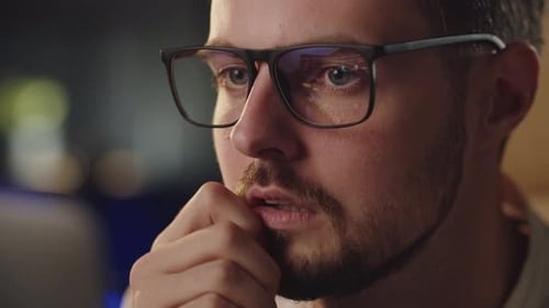 Businessman Analyzing Stock Market Eyeglasses Reflection of Trading Platform Thoughtful Investor Guy