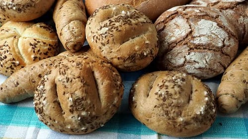 Variety of Fresh Bread Buns on Checkered Cloth