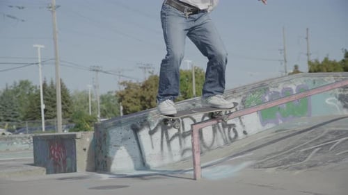 Skateboarder Performing Tricks in an Urban Skate Park