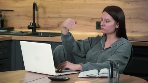 Tired Female Freelancer Turns Off Laptop and Goes to Bed