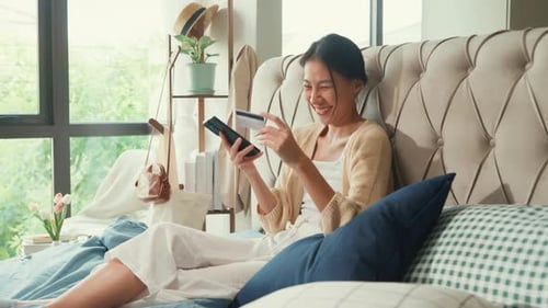Young Woman Shopping Online with Credit Card