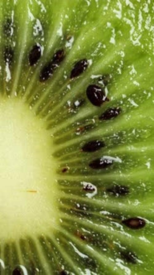 Sliced Kiwi Rotating Ripe Tropical Fruits Closeup Vertical