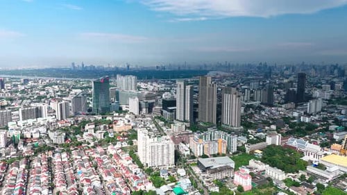 Drone panning left, view of Bangkok on a nice day