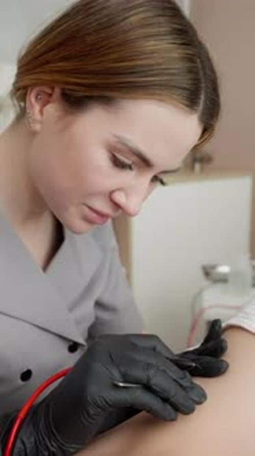 Beautician Applies Permanent Makeup in Medical Setting