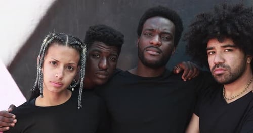 Serious Young Adults Posing Together