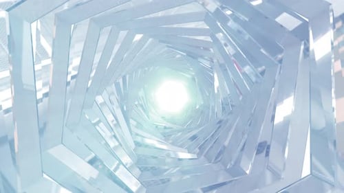 A rotating silver metallic chrome shiny tunnel with walls of ribs and lines in the form of a hexagon