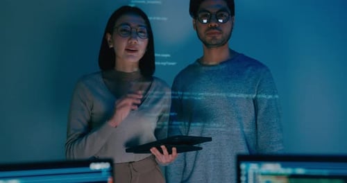 Group adult Asia male female software developers mentor leader manager talk strategy plan.