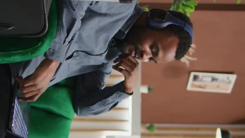 Vertical Video Tourist Enjoys Tv Show at Holiday Resort