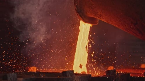 Pit Pours Liquid Metal Into Molds Stock Footage Liquid Mass of Molten Metal Pours Out of Pit Stream