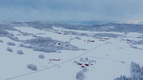 Panoramic View Over Snowy Landscape With Cabins And Forests In Indre Fosen, Norway - Drone Shot