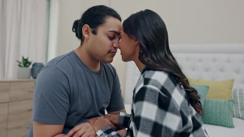 Romantic Couple Share Affectionate Moment in Bedroom
