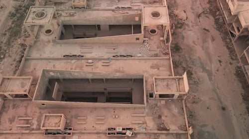 Aerial Drone View of Abandoned Concrete Building Under Construction with Empty Structure