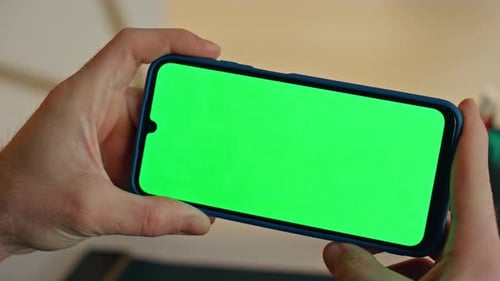 Businessperson Hands Holding Mockup Cellphone Working Remote at Office Closeup