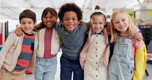 Cheerful Children Hugging, Smiling Happily Together Indoors