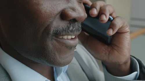 Man in Suit Talking on Mobile Phone Close Up