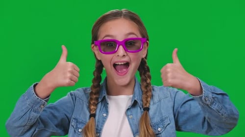 Brunette Cheerful Girl Gesturing Thumbs Up Smiling Looking at Camera Through 3D Glasses Closeup
