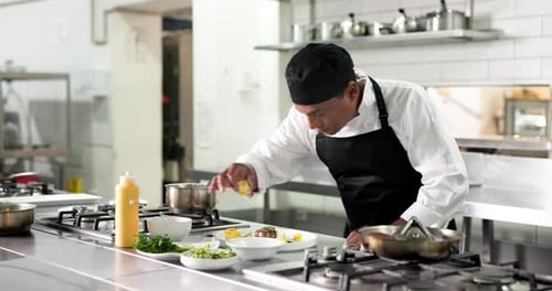 Plate, man and chef in kitchen for cooking at restaurant for meal preparation