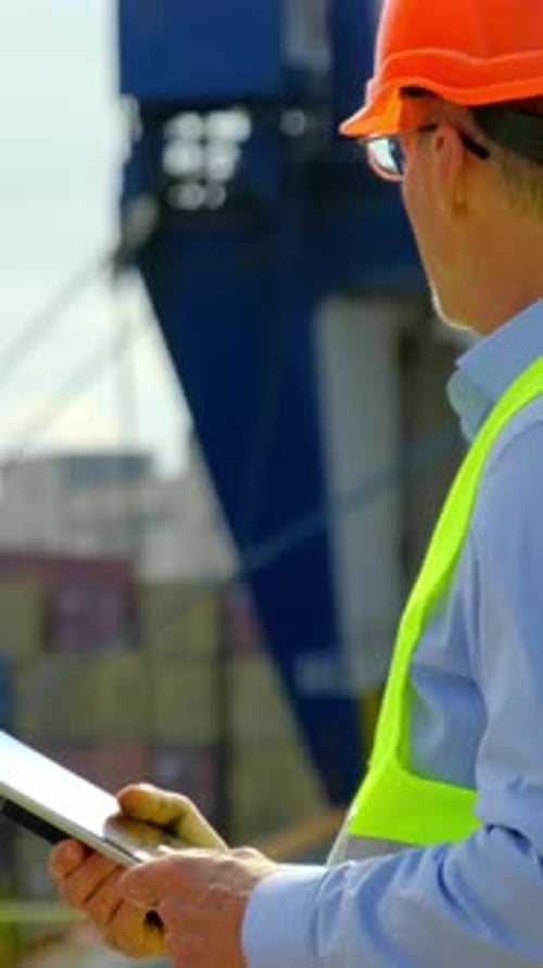 Sea Port Cargo Ship Technology Manager Checks Loading Order