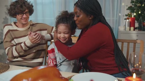 Family and Friends Celebrate Christmas Dinner at Home