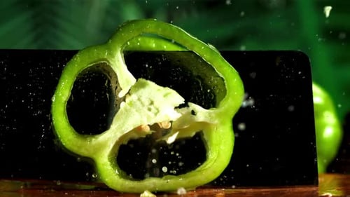 Close Up of Green Pepper Being Sliced