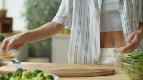 Woman Prepares Healthy Smoothie Ingredients in Kitchen
