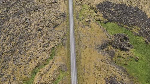 Reveal An Endless Road With Dramatic Nature Landscape In Iceland. Aerial Tilt-up