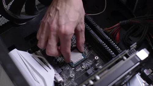 Closeup Cropped Shot of Unrecognizable Technician Male Master Removing CPU Processor Out of