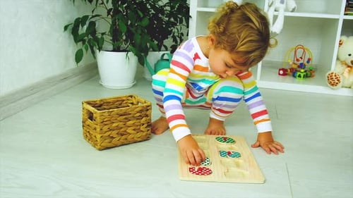 Young Child Playing with Puzzle at Home