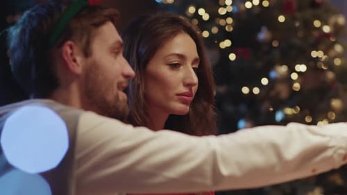 Couple Celebrate Christmas Together in Cozy Home