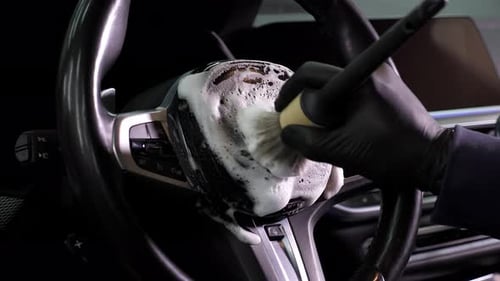 Car Cleaning Specialist Clean with a Brush and Foam