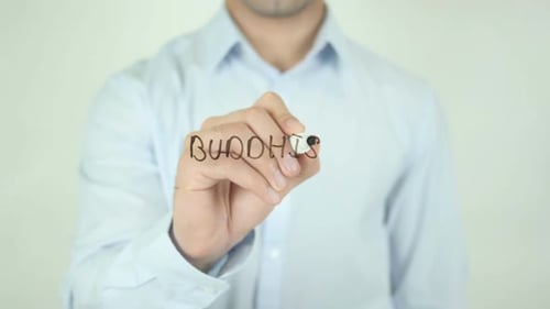 Man Writes Word Buddhism on Clear Surface