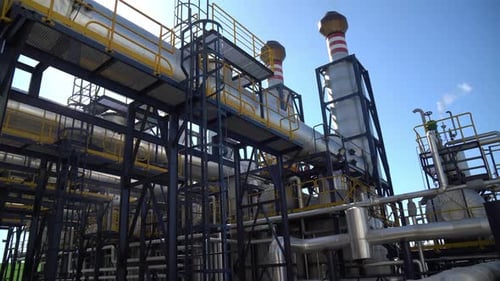 smoke-free chimneys against a blue sky