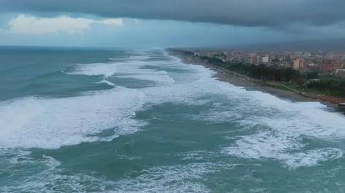 Gloomy View Of The Coastline with Big Waves