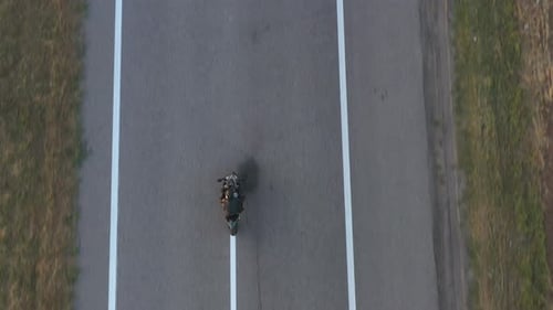Aerial Shot of Motorcyclist Racing His Motorcycle on Country Road