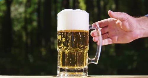Pouring Beer in Slow Motion Beer Fizz with Rising Foam Golden Ale Being Poured Beer Head Growing