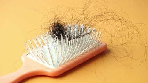 a Brush with Lost Hair on Table