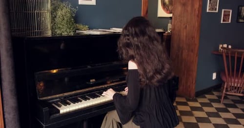Young Woman Plays Piano in an Urban Setting