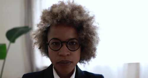African Business Woman Looking On Camera Inside Modern Office