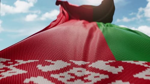 Realistic Waving Flag of Belarus Against Blue Sky