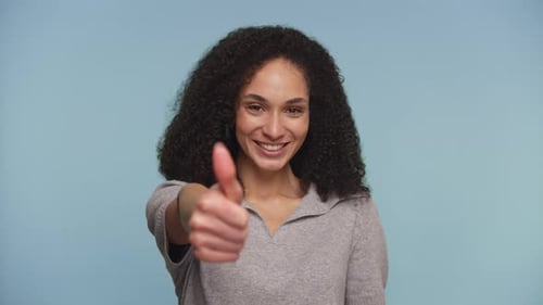 Happy Woman Giving Thumbs Up Approval Gesture