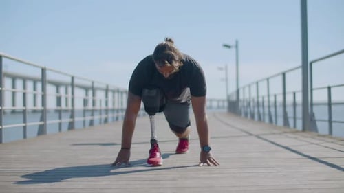Male Athlete with Disability Doing Stretching Exercises