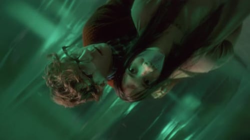 Portrait of Sinister Serial Killer and Terrified Hostage in Torture Room