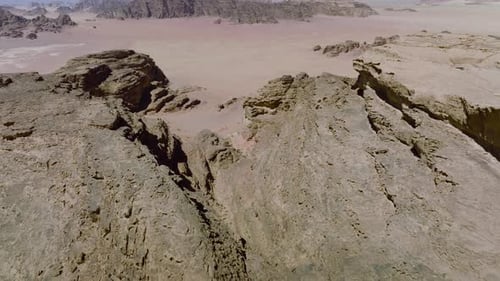 Aerial Views Over Steep Sandstone Cliffs In Wadi Rum Desert, Jordan. - Drone Unveiling Shot